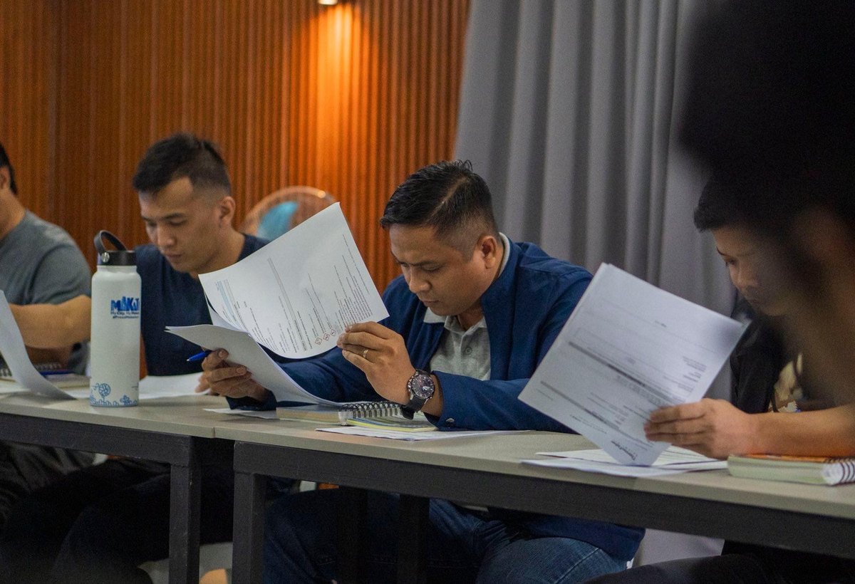 Participants reviewing assessment materials